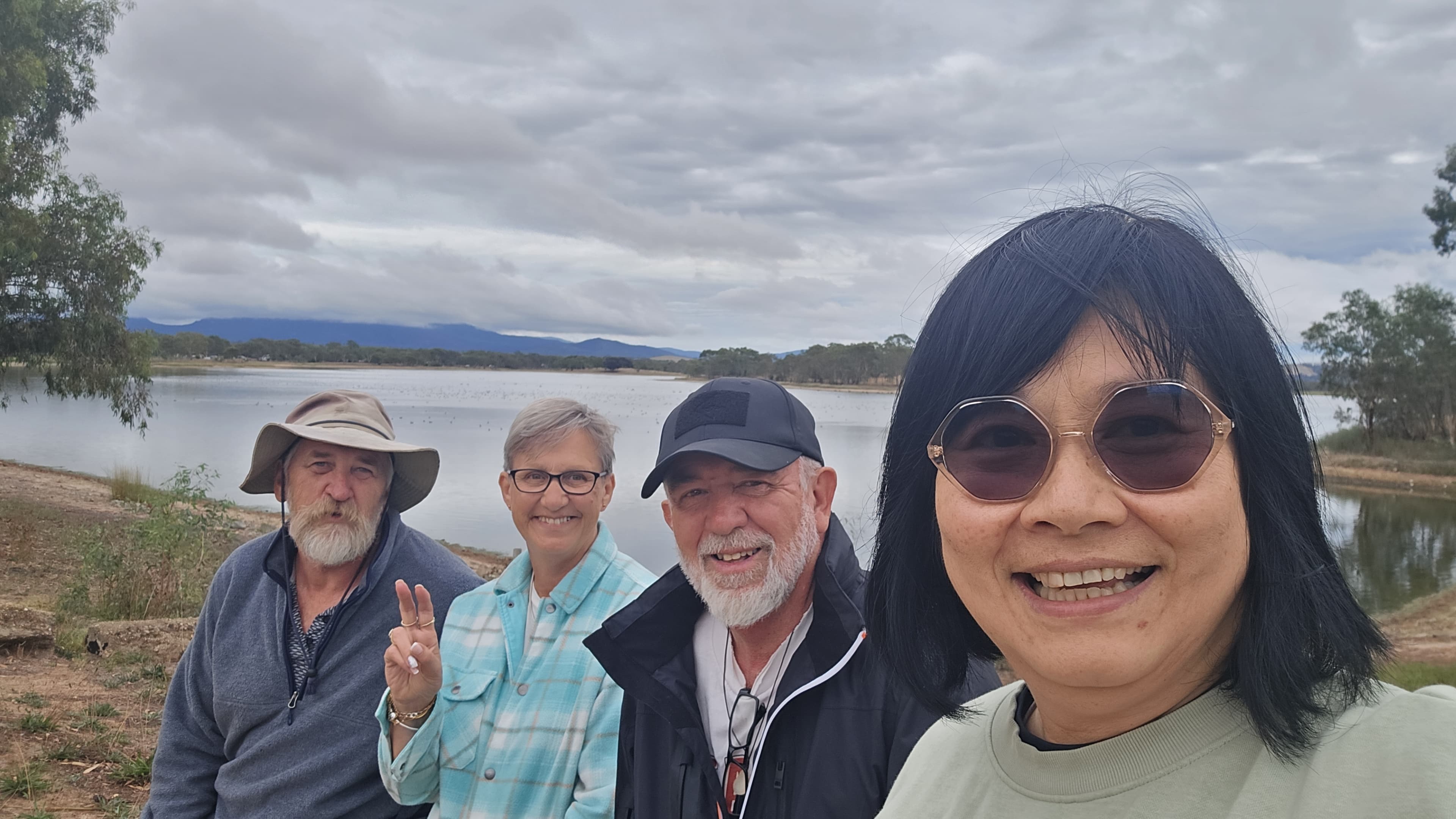Karen with friends on a walk by the lake